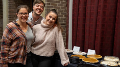 Three students participating in Rutgers Friendsgiving