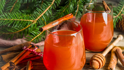 Image of holiday beverages in a glass sitting on a table