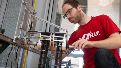Marko Mihalec (SOE '27) works in the Robotics Lab in Weeks Hall
