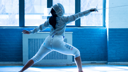 Robert Wood Johnson Medical School student Kamali Thompson fences