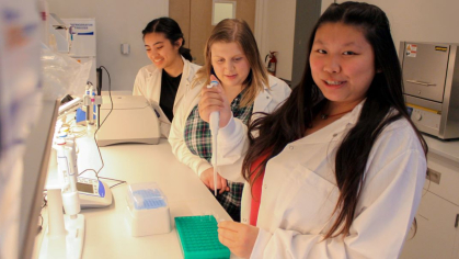 Sandy Paredes, Lucia Bellino, and Natlie Lau doing research in the anthropology laboratory