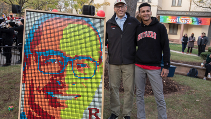 The president admires his image made out of Rubik’s Cubes, created by senior Dylan Sadiq.