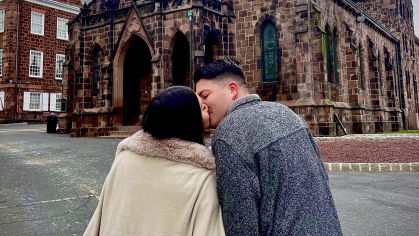 Alexandra Rodriguez and Salvatore Liguori kissing in front of Kirkpatrick Chapel