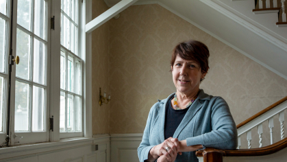 Debbie Walsh, director of the Center for American Women and Politics, standing by the window inside of Woodlawn Mansion, home to the Eagleton Institute of Politics