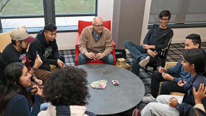 J.D. Bowers (center), dean of the Honors College at Rutgers–New Brunswick, plays Uno with a group of students, including (visible faces from left to right) Samantha Torres, Luis Sanchez-Gonzalez, Alex Liu, Ali Khan, Josh Ding and Ankita Akanksha.