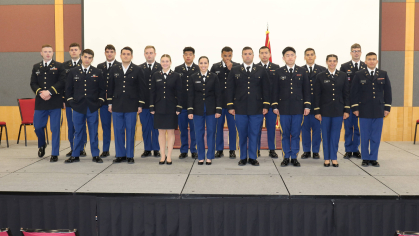 Rutgers Army ROTC 2023 graduates standing on stage