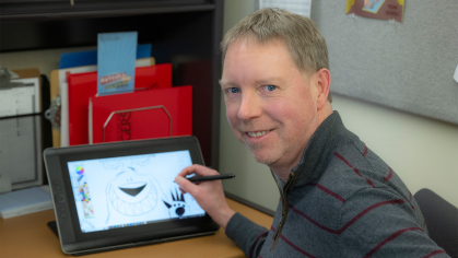 Mike Lucas drawing on a screen 