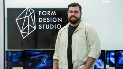 Rutgers–Newark student James Negri stands in the computer lab at the Form Design Studio, part of Express Newark