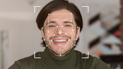 A smiling individual is displayed within a digital facial recognition framework, showcasing advanced identification technology.