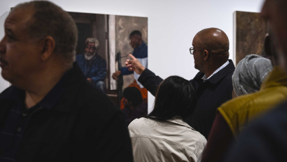 Visitors view artwork during the opening reception for "Alonzo Adams: A Griot’s Vision," on Sept. 23 at the Zimmerli Art Museum.