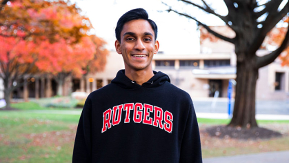 Animesh Borad on the Rutgers-Camden campus wearing black sweatshirt with Red Rutgers lettering