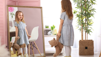 girl looking in mirror