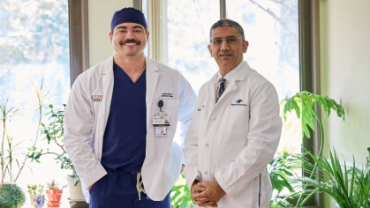 Rutgers medical student Justin Benton, left, with alumnus Dr. Ravi Goel at Goel's office in Cherry Hill, New Jersey. 
