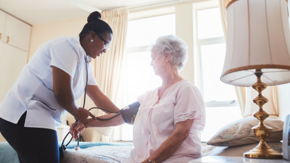 nurse takes blood pressure