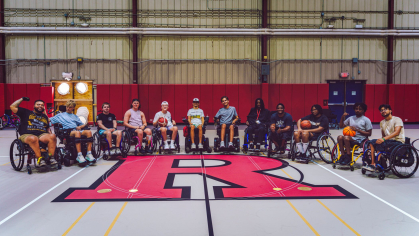 Members of True Grit camp, all of whom are in wheelchairs, gather after a basketball game (2025)