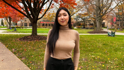 Zauresh Kapisheva standing on campus