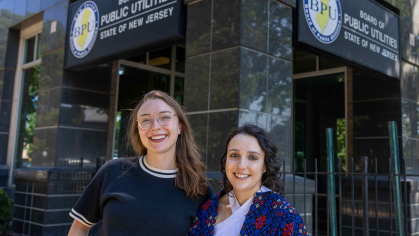 Research scientist Natalie Stuart (left), a 2023-2024 Eagleton Science fellow, stands with Aileen Eagleton, a current Eagleton Science fellow, outside the Board of Public Utilities office in Trenton, N.J.