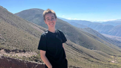 Rutgers alum Jay Schroepfer stands before a mountain vista in the province of Jujuy in northwest Argentina in April.