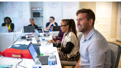 camden graduate school students sitting at a table