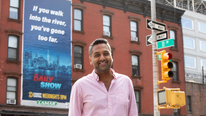 Sushil Dayal, a veteran of the Livingston Theater Company at Rutgers, stands in front of The Daily Show studio where he is an executive in charge of production.