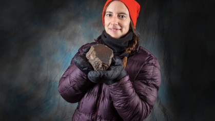 Juliane Gross holding a moon rock