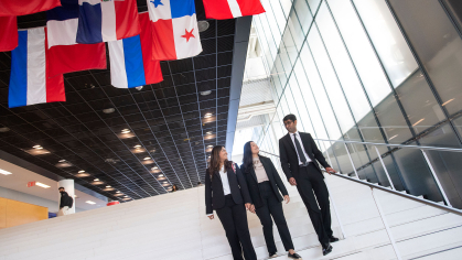 The International Honor Society: Beta Gamma Sigma members, Rashmi Kapse (RBS ’24), and Tulsi Chandan (RBS ’23), Raj Limbachia (RBS ’24) chat while descending the main staircase in the atrium of the Rutgers Business School on Livingston campus.