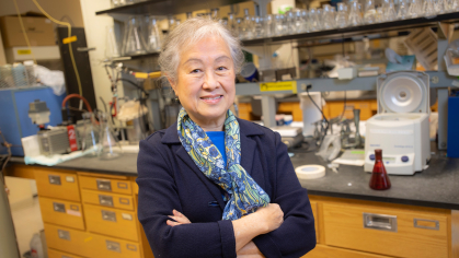 Lily Young standing arms crossed in a lab