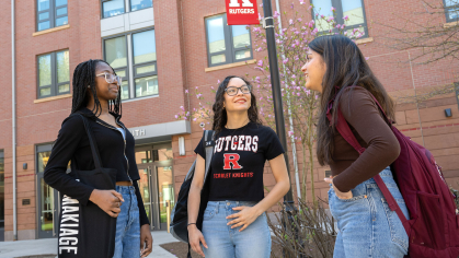 Rutgers students chat outside on the College Avenue campus
