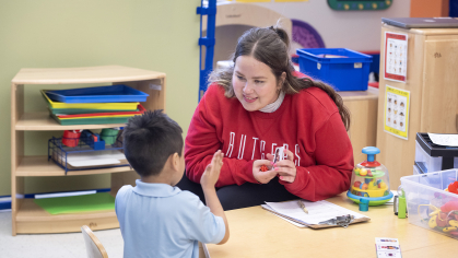 Rutgers junior Ara Spielman works with a preschooler at Paul Robeson Community School for the Arts.