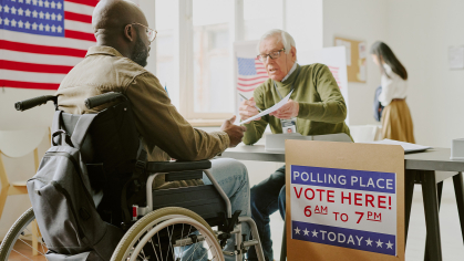 Person in wheelchair voting