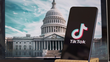 Phone with TikTok app imposed infront of US Capitol