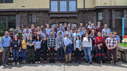 A group of men and women assembled in front of the Rutgers Inn