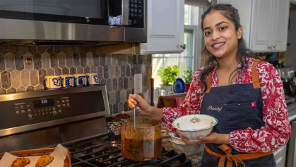 Rutgers senior Prachi Shashidhar serves up soup in her parents' kitchen.