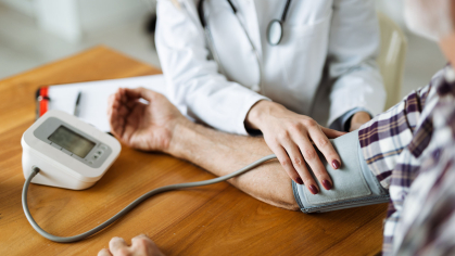 doctor checks blood pressure