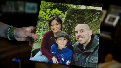 Jason Reed holds a printed photo of Sunny, Liam and himself, at their home in Cherry Hill. 