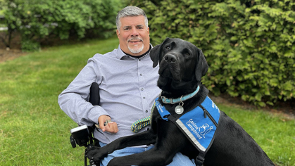 Javier Robles with his service dog 