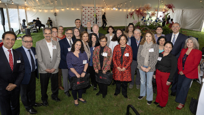 Faculty are congratulated by President Jonathan Holloway on 20 years of servce to the university 