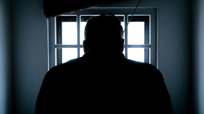 Man looking in window 