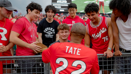 President Tate with Students at Football game