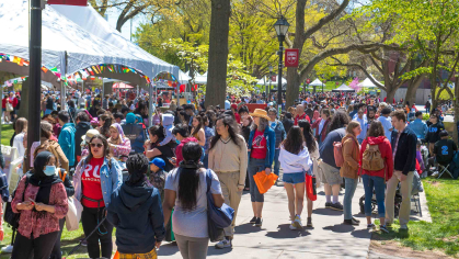Throngs of visitors walk along Voorhees Mall on College Avenue during Rutgers Day 2022.