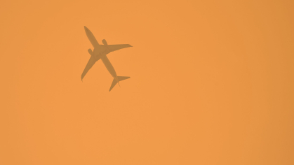 jet seen through wildfire smoke