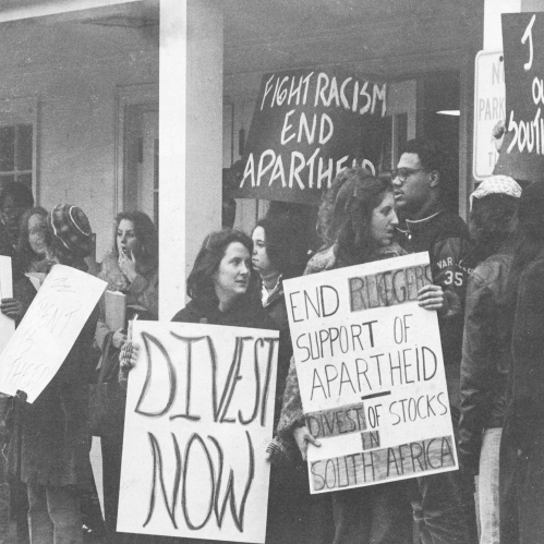 A multiracial group of Rutgers students rally for divestment.