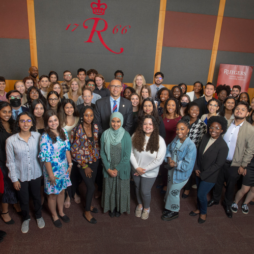 President Jonathan Holloway poses with students at the Rutgers Summer Service Institute launch event on May 19, 2022.