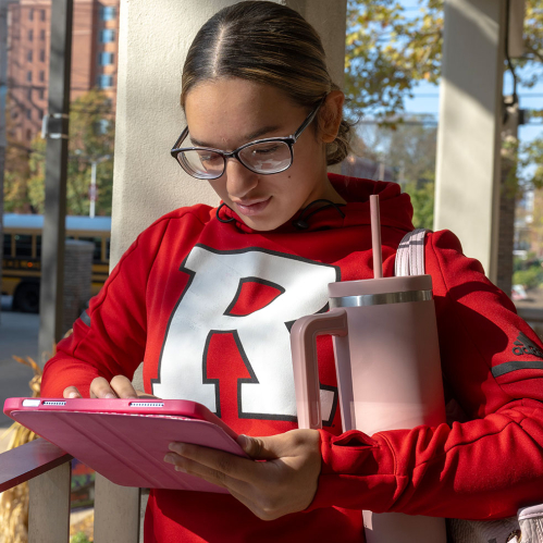 Rutgers camden student working on a tablet