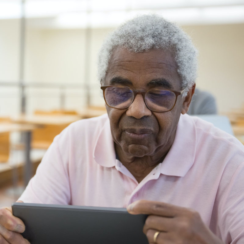 Elderly African American using a laptop