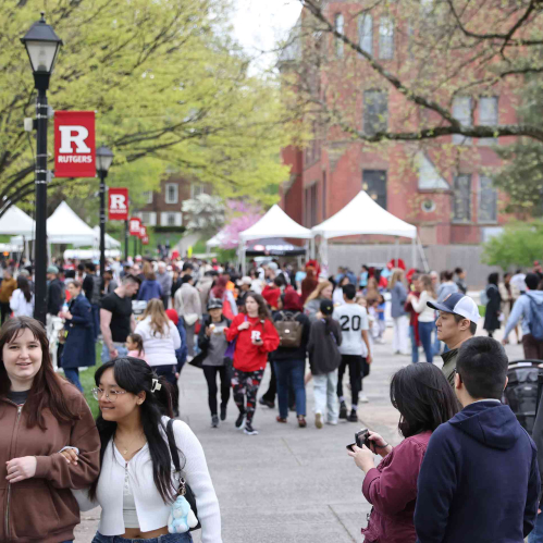 Students, faculty, alumni and community members walking around Voorhees Mall during Rutgers Day 2024.