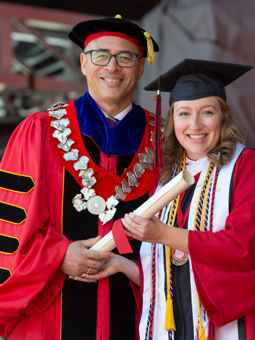 President Jonathan Holloway presents student body president Allison Smith with her diploma at the Rutgers’ 257th Anniversary Commencement