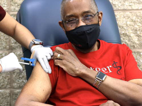 Dean Robert Johnson receiving COVID vaccine