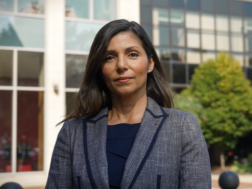 Carolina Cabrera DiGiorgio standing in front of the Rutgers Law School building at Rutgers-Camden