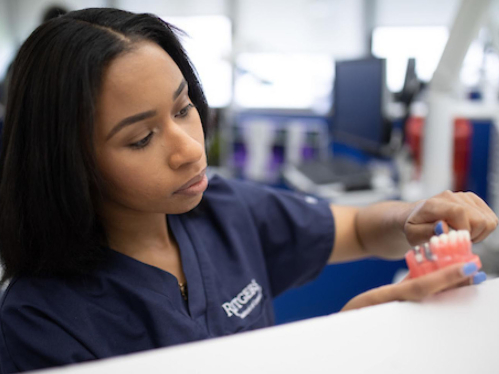 A Rutgers dental student makes dentures